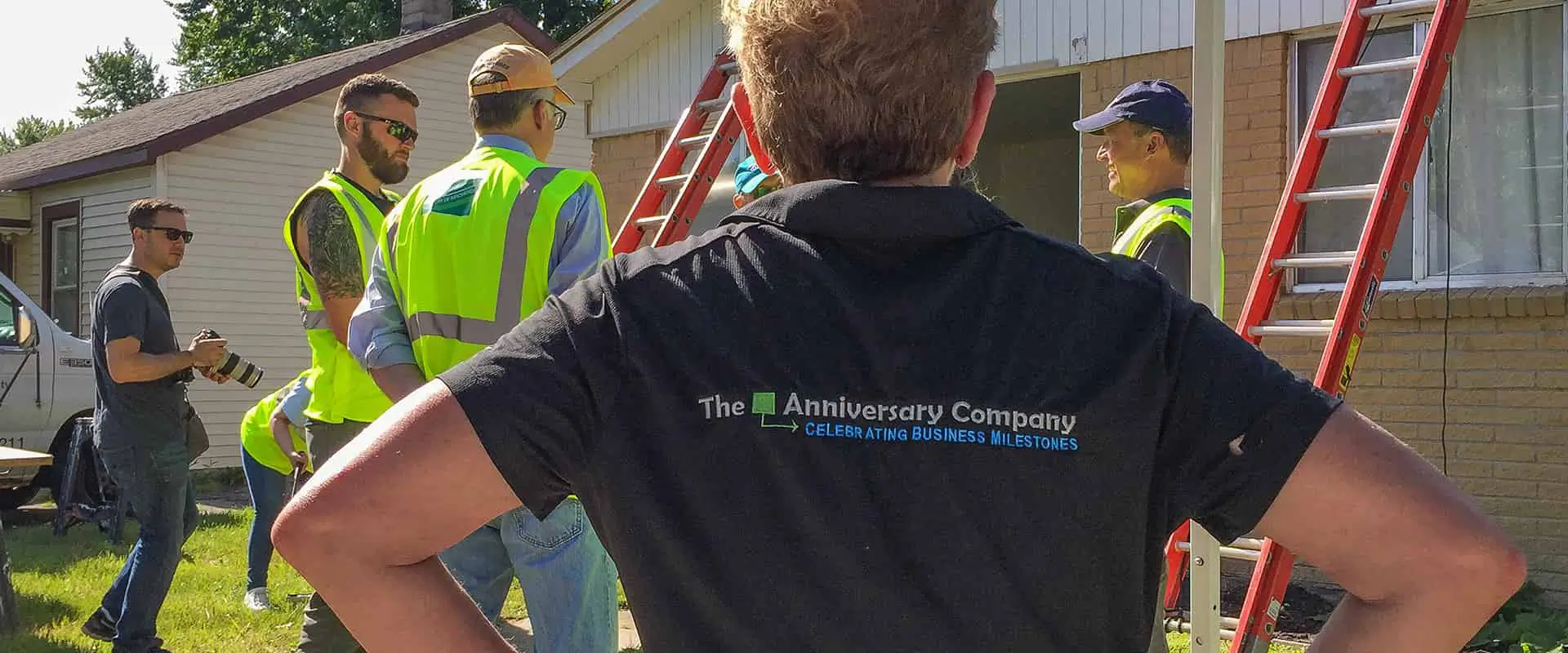 The Anniversary Company employee overseeing workers