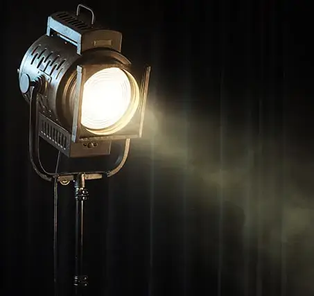 Spotlight with dark curtains in the background
