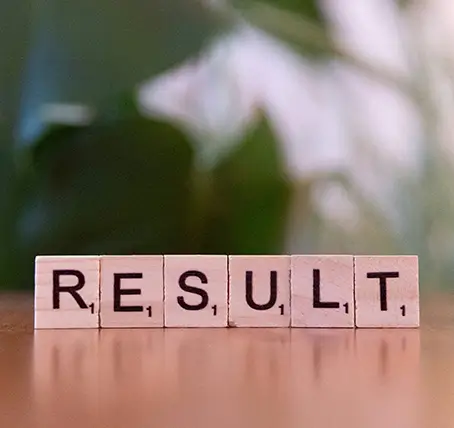 Scrabble blocks that spell "RESULT"