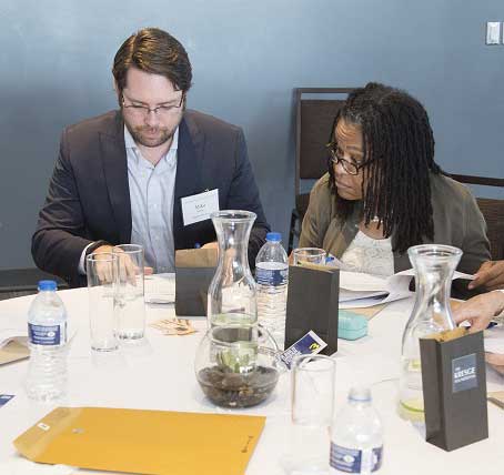 Attendees around a banquet table at a corporate anniversary celebration